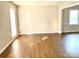 Inviting living room with hardwood floors, neutral walls, and ample natural light at 2314 Knickerbocker Dr, Charlotte, NC 28212