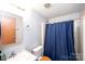 Practical bathroom with vanity and shower featuring a blue curtain at 237 Creekstone Ln, York, SC 29745