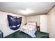 Cozy bedroom with a large bed, textured walls, and a window with a dark curtain at 237 Creekstone Ln, York, SC 29745