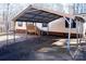 A spacious carport is attached to this single-story home with steps leading to the front door at 237 Creekstone Ln, York, SC 29745