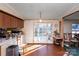 Bright dining area with hardwood floors, wooden chairs, and patio access at 237 Creekstone Ln, York, SC 29745
