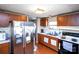 Functional kitchen with wood cabinets, stainless steel refrigerator, and appliances at 237 Creekstone Ln, York, SC 29745