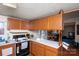 Charming kitchen with light countertops, wood cabinets, and an open view to the adjacent living space at 237 Creekstone Ln, York, SC 29745