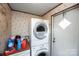 A laundry room equipped with a modern stackable washer and dryer at 237 Creekstone Ln, York, SC 29745