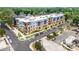 Aerial view of an attractive condo building with lush greenery, parking, and a prime location at 2401 Euclid Ave # 213, Charlotte, NC 28203