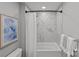 Nicely renovated bathroom showcasing new shower and tub with sleek white tiles at 2401 Euclid Ave # 213, Charlotte, NC 28203