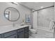 Modern bathroom with stylish vanity, framed mirror, and tiled shower-tub combination at 2401 Euclid Ave # 213, Charlotte, NC 28203
