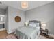 Comfortable bedroom featuring neutral walls, wood floors, and a queen size bed at 2401 Euclid Ave # 213, Charlotte, NC 28203