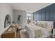 Comfortable bedroom featuring hardwood floors, neutral walls and a king size bed at 2401 Euclid Ave # 213, Charlotte, NC 28203