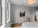 Bright bedroom featuring a large dresser, hardwood floors, and natural light at 2401 Euclid Ave # 213, Charlotte, NC 28203