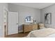 Bright bedroom features wood floors, a large mirror over the dresser and neutral decor at 2401 Euclid Ave # 213, Charlotte, NC 28203