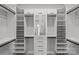Organized walk-in closet with mirrored doors, built-in shelving and ample storage space at 2401 Euclid Ave # 213, Charlotte, NC 28203