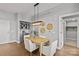 Light and airy dining area with stylish lighting fixture and built-in bar perfect for entertaining guests at 2401 Euclid Ave # 213, Charlotte, NC 28203