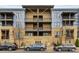 Attractive apartment building featuring a modern design, balconies, and convenient street parking at 2401 Euclid Ave # 213, Charlotte, NC 28203