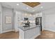 Clean lines in this kitchen with white cabinetry, stainless steel microwave, and a cooktop oven at 2401 Euclid Ave # 213, Charlotte, NC 28203