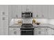 Close view of the cooktop and white backsplash, a design that maximizes space and aesthetics at 2401 Euclid Ave # 213, Charlotte, NC 28203
