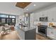 Bright, open kitchen featuring a large island, modern appliances, pendant lighting, and connection to the living room at 2401 Euclid Ave # 213, Charlotte, NC 28203