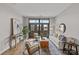 Inviting living room bathed in natural light, featuring hardwood floors, comfortable seating, and access to a balcony at 2401 Euclid Ave # 213, Charlotte, NC 28203