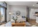Cozy living room with a comfortable sofa, stylish accents, and views of the adjacent kitchen area at 2401 Euclid Ave # 213, Charlotte, NC 28203