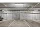 Underground parking with marked spaces and overhead lighting provides secure and convenient vehicle storage at 2401 Euclid Ave # 213, Charlotte, NC 28203