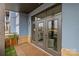 Private patio featuring wood flooring, an artificial grass section and glass doors at 2401 Euclid Ave # 213, Charlotte, NC 28203