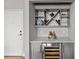 Convenient wine bar area with counter space, shelving, and a wine refrigerator for ultimate convenience at 2401 Euclid Ave # 213, Charlotte, NC 28203