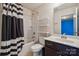Bathroom with a shower-tub combo, vanity, and decorative black and white shower curtain at 241 Catoctin Rd, Rock Hill, SC 29732