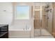 Bright bathroom featuring a soaking tub and glass-enclosed shower at 241 Catoctin Rd, Rock Hill, SC 29732