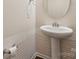 Elegant powder room featuring a pedestal sink and decorative wall paneling at 241 Catoctin Rd, Rock Hill, SC 29732
