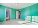 Well-lit bedroom with teal walls and connected hallway and other rooms at 241 Catoctin Rd, Rock Hill, SC 29732