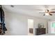 Bright bedroom featuring a ceiling fan, neutral carpet, a dresser, and ensuite bath access at 241 Catoctin Rd, Rock Hill, SC 29732