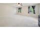 Bright bedroom with neutral carpet and curtains on the large windows at 241 Catoctin Rd, Rock Hill, SC 29732
