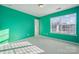 A bright, empty bedroom featuring fresh teal paint and natural light at 241 Catoctin Rd, Rock Hill, SC 29732