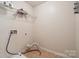 Practical laundry room featuring tile flooring and utility connections at 241 Catoctin Rd, Rock Hill, SC 29732