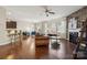 Bright and open living area with hardwood floors, large windows, a fireplace, and a view into other rooms at 241 Catoctin Rd, Rock Hill, SC 29732