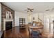 Cozy living room featuring a stone fireplace, hardwood floors, comfortable seating, and stylish decor at 241 Catoctin Rd, Rock Hill, SC 29732