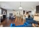 Spacious open-concept living room with hardwood floors, a fireplace, a kitchen, and comfortable seating areas at 241 Catoctin Rd, Rock Hill, SC 29732