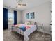 Bright bedroom with a ceiling fan, large window, and colorful décor at 2419 Paddlers Cove Dr, Clover, SC 29710