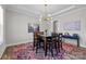 Elegant dining room featuring modern lighting, stylish decor, and a comfortable dining atmosphere at 2419 Paddlers Cove Dr, Clover, SC 29710