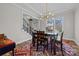 Elegant dining room featuring hardwood floors, modern lighting, and a comfortable dining atmosphere at 2419 Paddlers Cove Dr, Clover, SC 29710