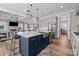 Open kitchen with island sink, stainless appliances, and sightlines to the living room at 2419 Paddlers Cove Dr, Clover, SC 29710