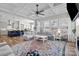 Bright living room boasts large windows, an open layout, and seamless transition to the modern kitchen at 2419 Paddlers Cove Dr, Clover, SC 29710