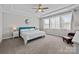 Serene main bedroom with large windows, a ceiling fan, and calming neutral color palette at 2419 Paddlers Cove Dr, Clover, SC 29710