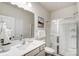 Modern bathroom with a glass-enclosed shower, sleek vanity, and elegant fixtures at 2534 Crimson Way, Monroe, NC 28112