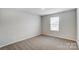 Bright bedroom with neutral walls, and soft carpet creating a warm and inviting space at 2534 Crimson Way, Monroe, NC 28112