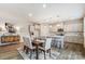 Contemporary dining room with modern light fixtures, open to the kitchen and dining area at 2534 Crimson Way, Monroe, NC 28112
