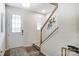Bright entryway featuring a staircase, coat rack, and stylish decor at 2534 Crimson Way, Monroe, NC 28112