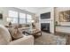 Inviting living room with a cozy fireplace, large windows, and comfortable seating area at 2534 Crimson Way, Monroe, NC 28112