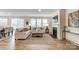 Bright living room with hardwood floors, fireplace, and lots of natural light from the windows and glass door at 2534 Crimson Way, Monroe, NC 28112