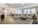 Spacious living room with hardwood floors, comfortable seating, and ample natural light at 2534 Crimson Way, Monroe, NC 28112